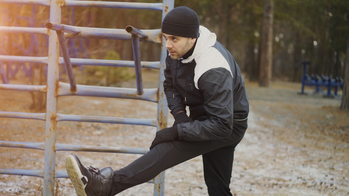 Professional trainer demonstrating proper exercise form with client
